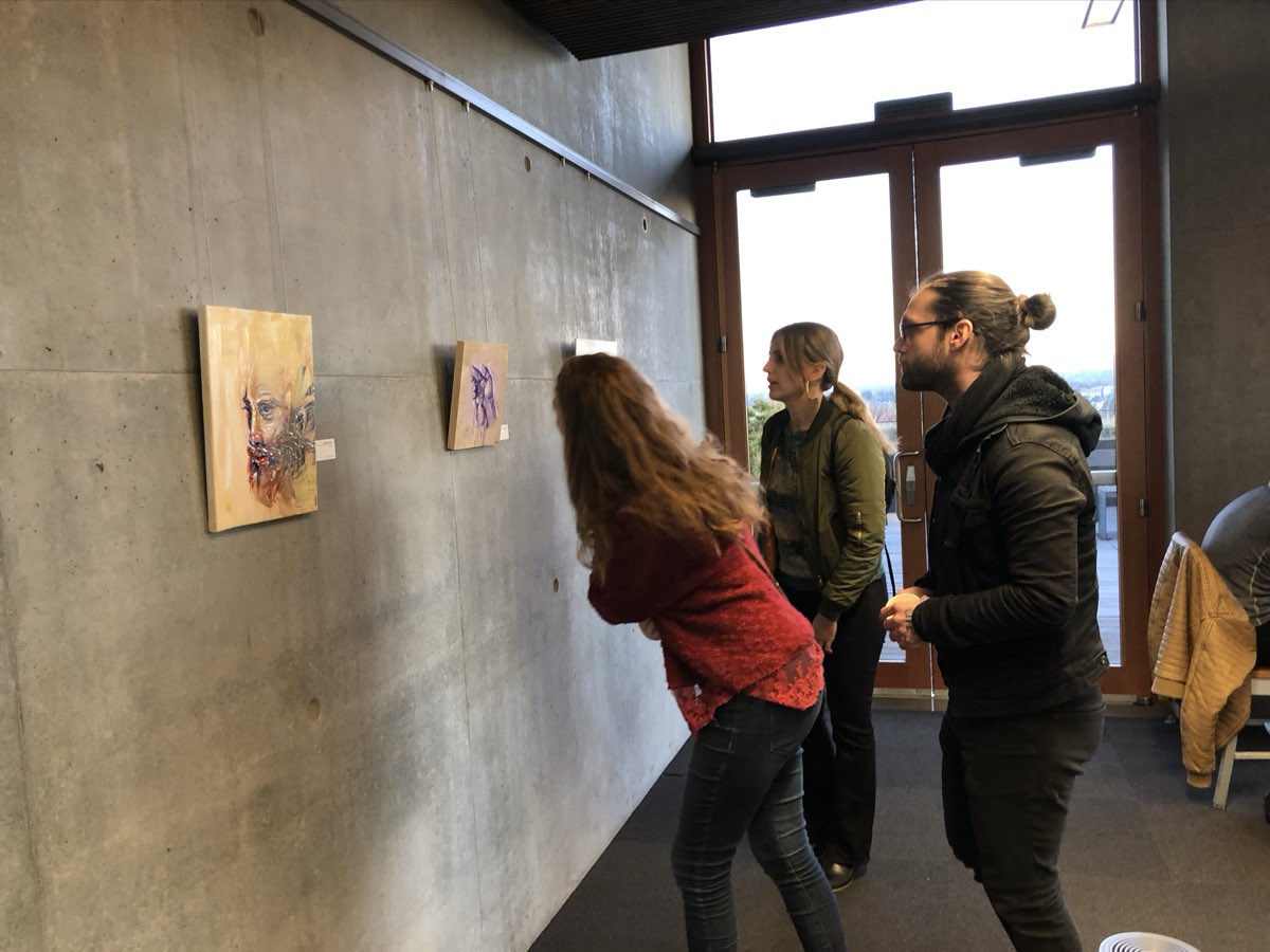 Installing paintings for the solo show